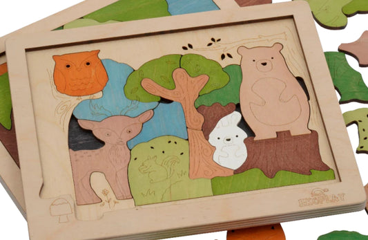 Wooden forest-themed puzzle featuring animals like a bear, deer, owl, and rabbit around a tree, with layered pieces designed for interactive play and early learning.